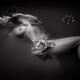 Beautiful naked woman lying half submerged in dark black water. Artist... (thumbnail)