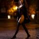 Gorgeous woman in black trench coat revealing sexy lingerie and stocki... (thumbnail)