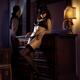 Sexy cat lady in a mask black lingerie and stockings leaning in seduct... (thumbnail)
