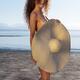 Sexy girl with a mischievous teasing look standing naked on a sunny be... (thumbnail)