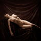 Fine art nude figure portrait of a beautiful woman with sensual volupt... (thumbnail)