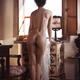 Rear view of a woman with beautiful voluptuous sensual body standing n... (thumbnail)