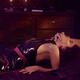 Man's hand caressing neck of a woman reclining on a bed in a sens... (thumbnail)