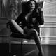 Gorgeous seductive woman in leather jacket sitting half naked in vinta... (thumbnail)