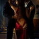Two elegant men seducing a beautiful classy lady in red evening dress.... (thumbnail)