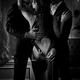Two elegant men seducing a beautiful classy lady in open back dress. M... (thumbnail)