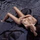 Gorgeous nude woman lying in dark sea water. Artistic erotic photograp... (thumbnail)