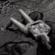 Gorgeous nude woman lying in dark sea water. Black and white erotic ph... (thumbnail)