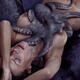 Nude woman lying on sea shore in passionate embrace of octopus tentacl... (thumbnail)