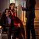 Gentleman lights a cigarette of a beautiful lady in red evening dress... (thumbnail)