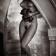 Black and white nude portrait of a beautiful young woman standing nake... (thumbnail)
