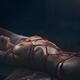Erotic photograph of nude woman lying down tied up with red Shibari bo... (thumbnail)