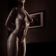 Black and white art nude photo of a beautiful naked woman with shiny s... (thumbnail)