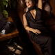 Elegantly dressed classy woman lying relaxing on couch listening to vi... (thumbnail)