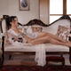 Gorgeous sexy lady Venetian courtesan with sensual half-naked body lyi... (thumbnail)