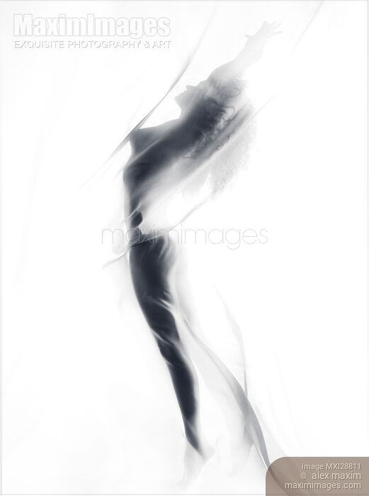 Abstract illusive silhouette of a nude woman suspended in glowing mist Stock photo of Abstract illusive silhouette of a nude woman suspended in glowing mist Buy commercial use license at MaximImages