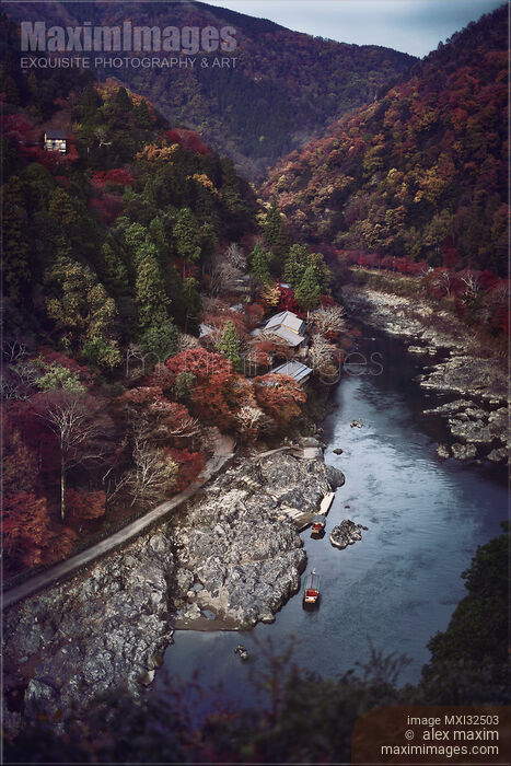 Stock photo of Aerial autumn scenery of Katsura River at Arashiyama with boats by the shore and Senko-ji temple Kyoto Buy commercial use license at MaximImages