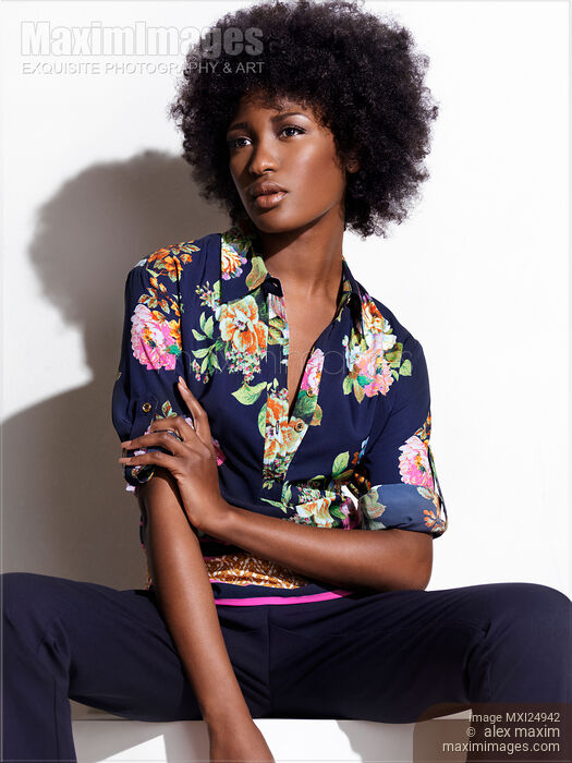 African american woman in dark blue fashionable clothes Stock photo of African american woman in dark blue fashionable clothes Buy commercial use license at MaximImages