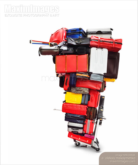 Stock photo of Airport cart with an enormous pile of luggage on it Buy commercial use license at MaximImages