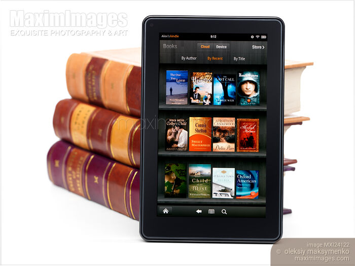 Amazon Kindle Fire leaning against books Stock photo of Amazon Kindle Fire leaning against books Buy commercial use license at MaximImages