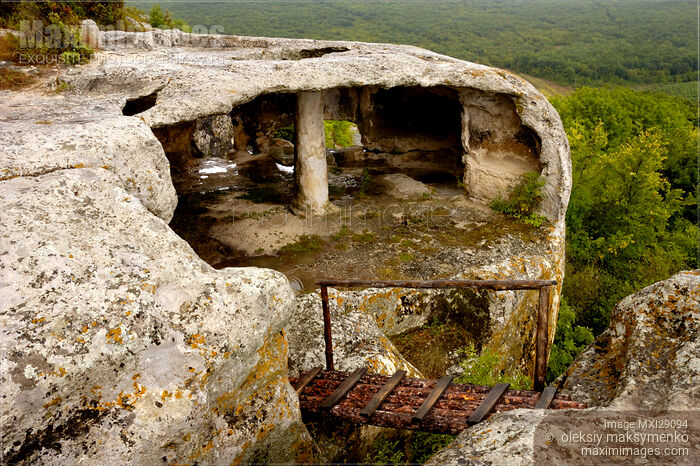 Stock photo of Ancient Dwelling Cut In Rock Buy commercial use license at MaximImages