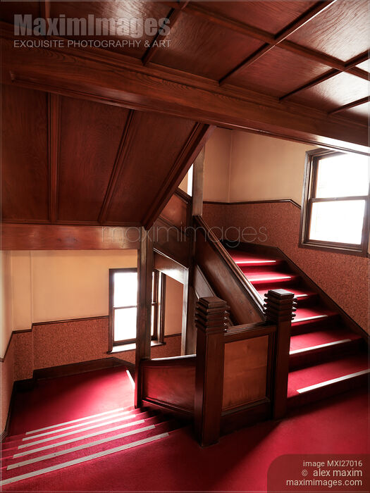 Stock photo of Antique wooden stairs with red carpet Buy commercial use license at MaximImages