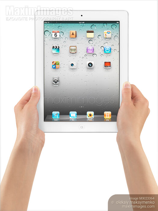 Apple iPad 2 Tablet Computer in Hands Stock photo of Apple iPad 2 Tablet Computer in Hands Buy commercial use license at MaximImages