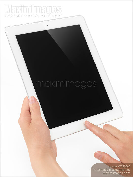 Apple iPad 2 Tablet Computer in Hands Stock photo of Apple iPad 2 Tablet Computer in Hands Buy commercial use license at MaximImages