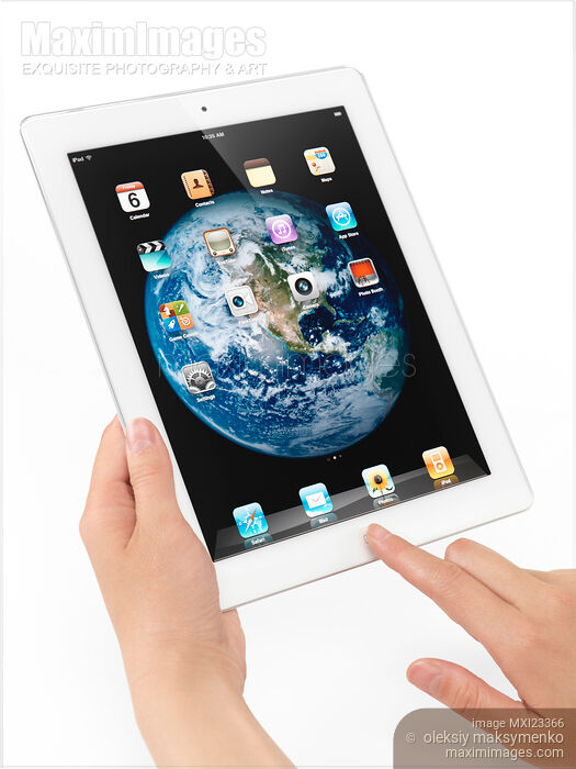 Apple iPad 2 Tablet Computer in Hands Stock photo of Apple iPad 2 Tablet Computer in Hands Buy commercial use license at MaximImages