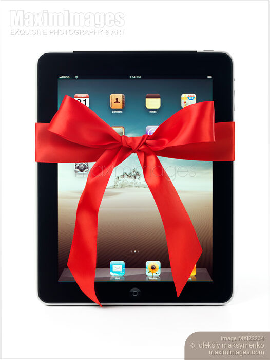 Stock photo of Apple iPad 3G Tablet with a Gift Bow Buy commercial use license at MaximImages