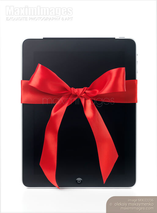 Apple iPad 3G Tablet with a Gift Bow Stock photo of Apple iPad 3G Tablet with a Gift Bow Buy commercial use license at MaximImages