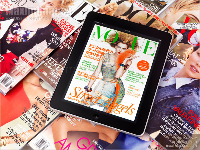 Stock photo of Apple iPad Issue of Vogue on top of Printed Magazines Buy commercial use license at MaximImages
