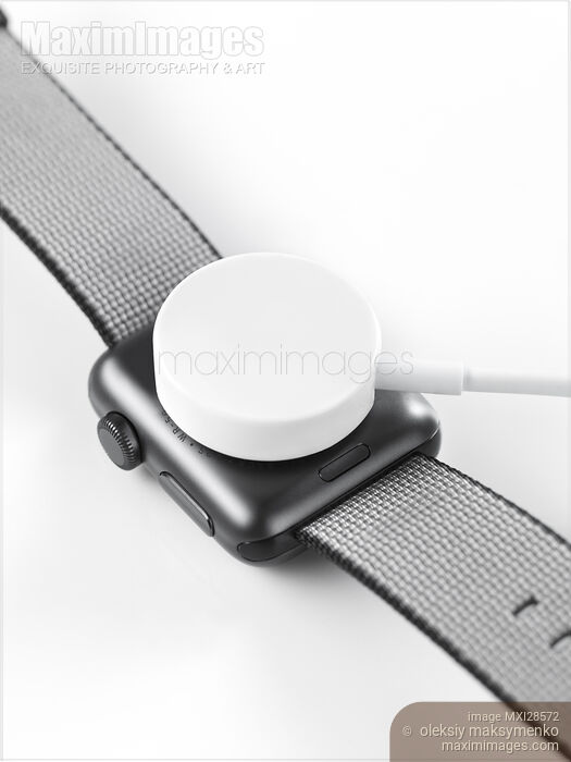 Apple Watch wireless charger Stock photo of Apple Watch wireless charger Buy commercial use license at MaximImages