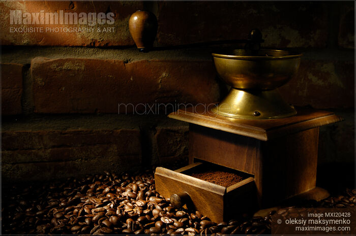 old coffee grinder with coffee beans