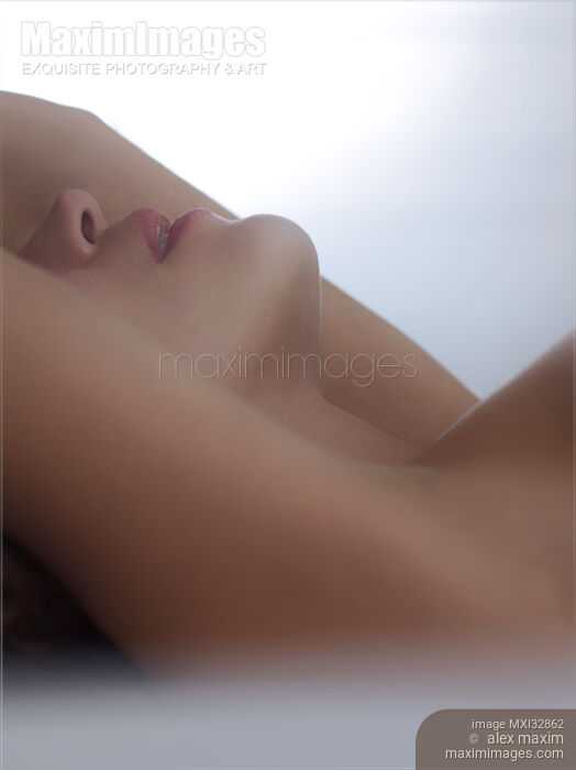 Artistic closeup of sensual nude woman lips and neck Making love in bed implied concept Stock photo of Artistic closeup of sensual nude woman lips and neck Making love in bed implied concept Buy commercial use license at MaximImages