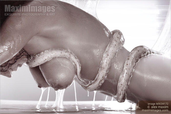 Artistic erotic sci-fi monochrome photo of a nude woman with slimy tentacles wrapped around her naked body Stock photo of Artistic erotic sci-fi monochrome photo of a nude woman with slimy tentacles wrapped around her naked body Buy commercial use license at MaximImages