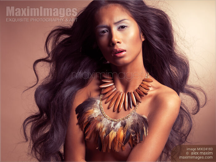 Artistic ethnic portrait of a beautiful young woman with long flying hair Stock photo of Artistic ethnic portrait of a beautiful young woman with long flying hair Buy commercial use license at MaximImages