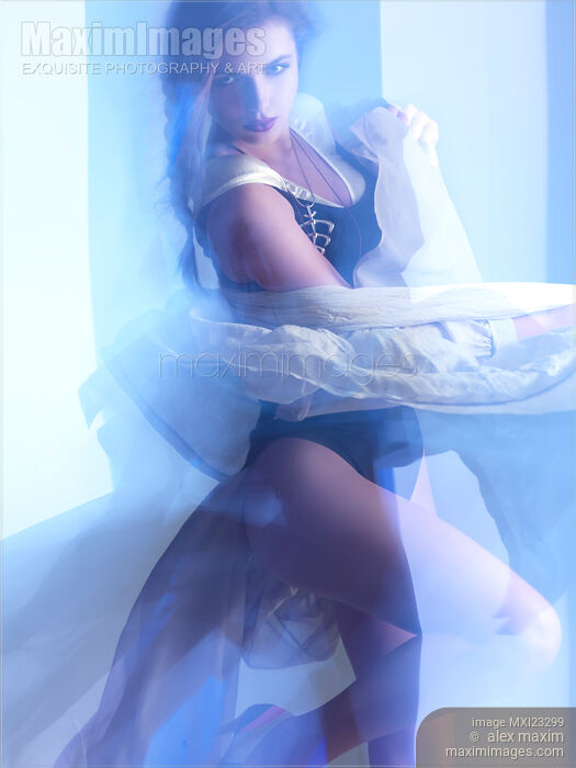 Stock photo of Artistic fashion photo of Woman Dancing in Light Buy commercial use license at MaximImages