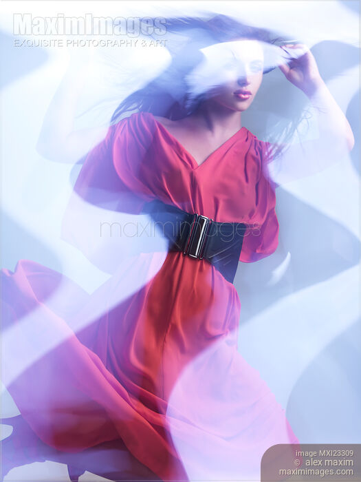 Artistic Fashion Photo of Woman in Shining Blue Light Wearing Red Dress Stock photo of Artistic Fashion Photo of Woman in Shining Blue Light Wearing Red Dress Buy commercial use license at MaximImages