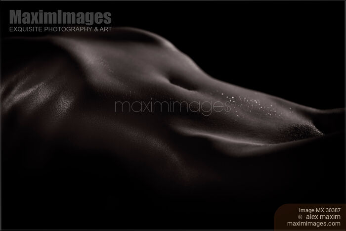 Artistic nude abstract black and white body parts of a sexy woman stomach with shiny wet skin Stock photo of Artistic nude abstract black and white body parts of a sexy woman stomach with shiny wet skin Buy commercial use license at MaximImages