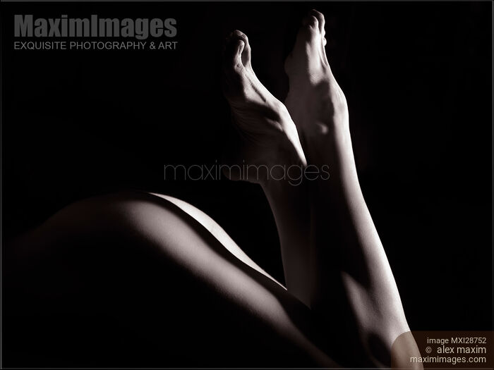 Artistic photo of bare woman legs Black and white Stock photo of Artistic photo of bare woman legs Black and white Buy commercial use license at MaximImages