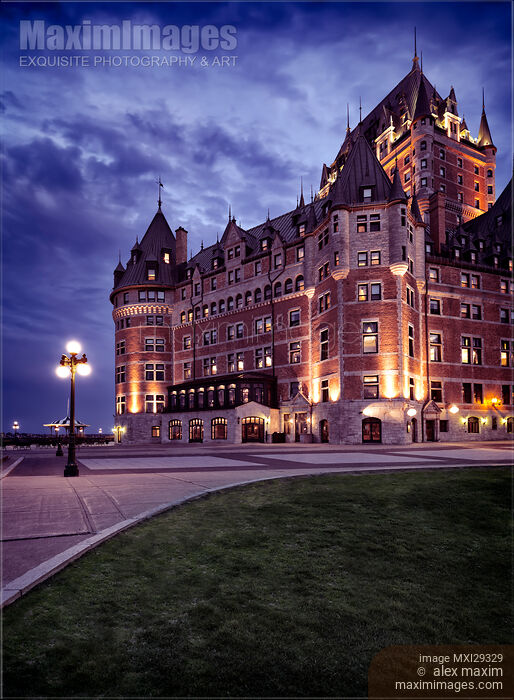 Stock photo of Artistic photo of Fairmont Le Château Frontenac lit by streetlights at night in Old Quebec City Buy commercial use license at MaximImages