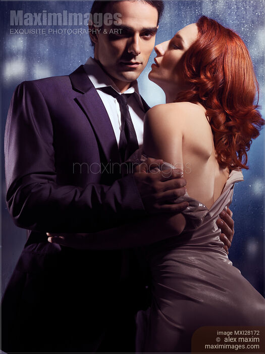 Artistic portrait of couple standing near window Stock photo of Artistic portrait of couple standing near window Buy commercial use license at MaximImages