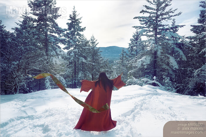 Stock photo of Asian woman in red kimono dancing on the snow in the forest Buy commercial use license at MaximImages