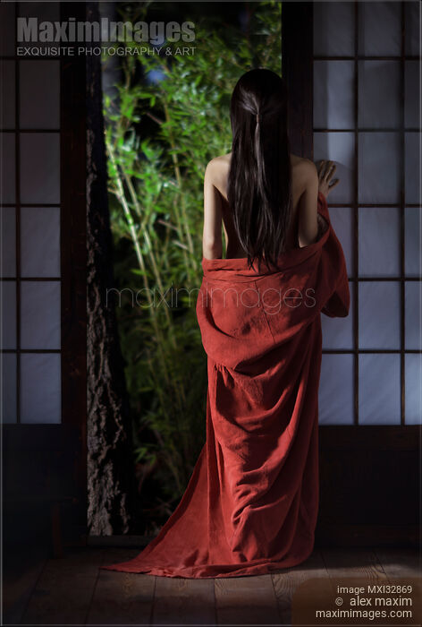 Asian woman in undone red kimono with long hair standing by a shoji door of a Japanese house Stock photo of Asian woman in undone red kimono with long hair standing by a shoji door of a Japanese house Buy commercial use license at MaximImages