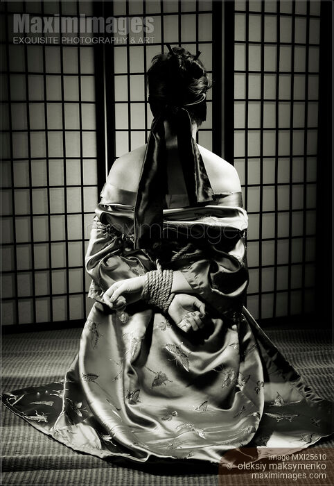 Stock photo of Asian Woman with Her Hands Tied Behind Her Back Buy commercial use license at MaximImages