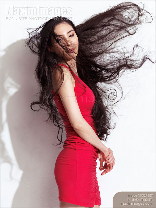 Asian woman with long flying black hair Stock photo of Asian woman with long flying black hair Buy commercial use license at MaximImages