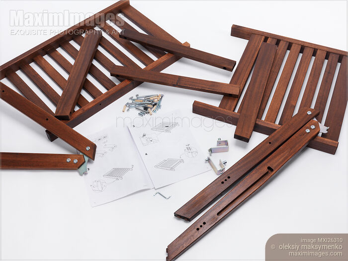 Stock photo of Assembling IKEA furniture parts Buy commercial use license at MaximImages