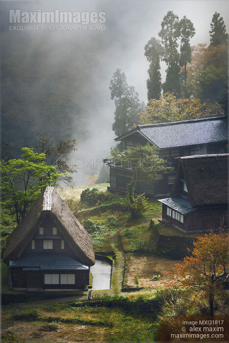 Stock photo of Atmospheric scenery of Ainokura Japanese mountain village Gassho style rural houses on a misty morning Buy commercial use license at MaximImages