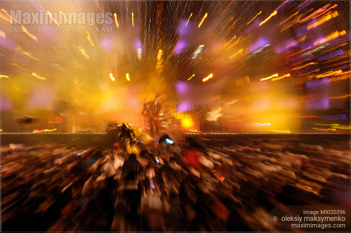 Stock photo of Audience Watching Rock Band Performing on Stage Buy commercial use license at MaximImages